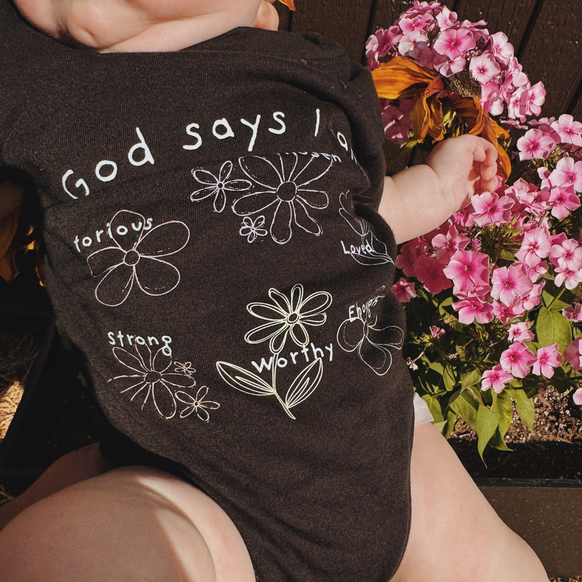 God Says I Am Flowers - Baby Organic Onesie, black, worn