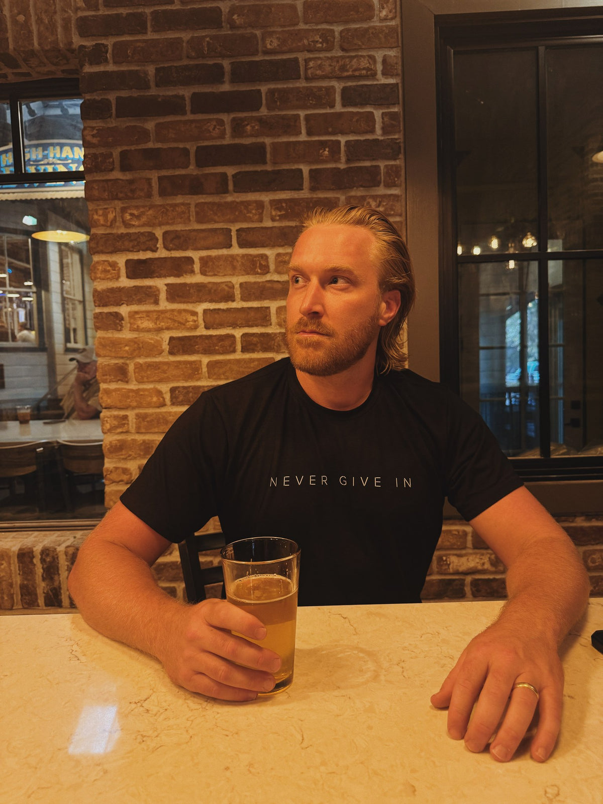 Never Give In - Adult Organic Bamboo Tee, black, worn