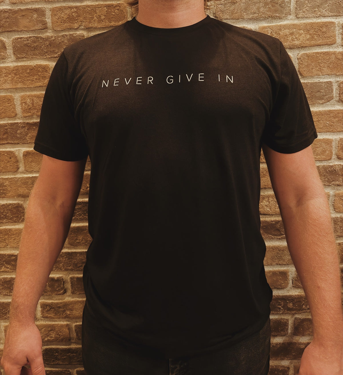 Never Give In - Adult Organic Bamboo Tee, black, worn