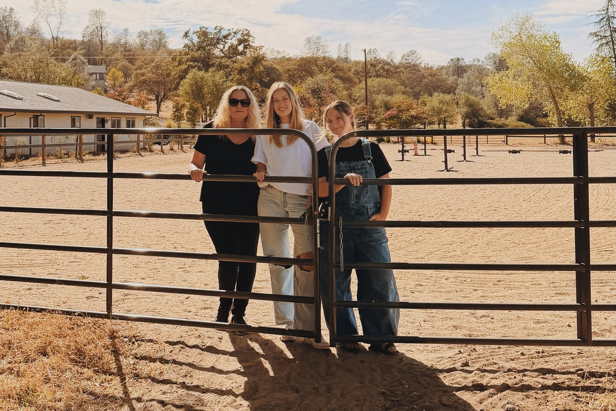 Tammi, Camille and Grace at the gate of the arena, Northern California